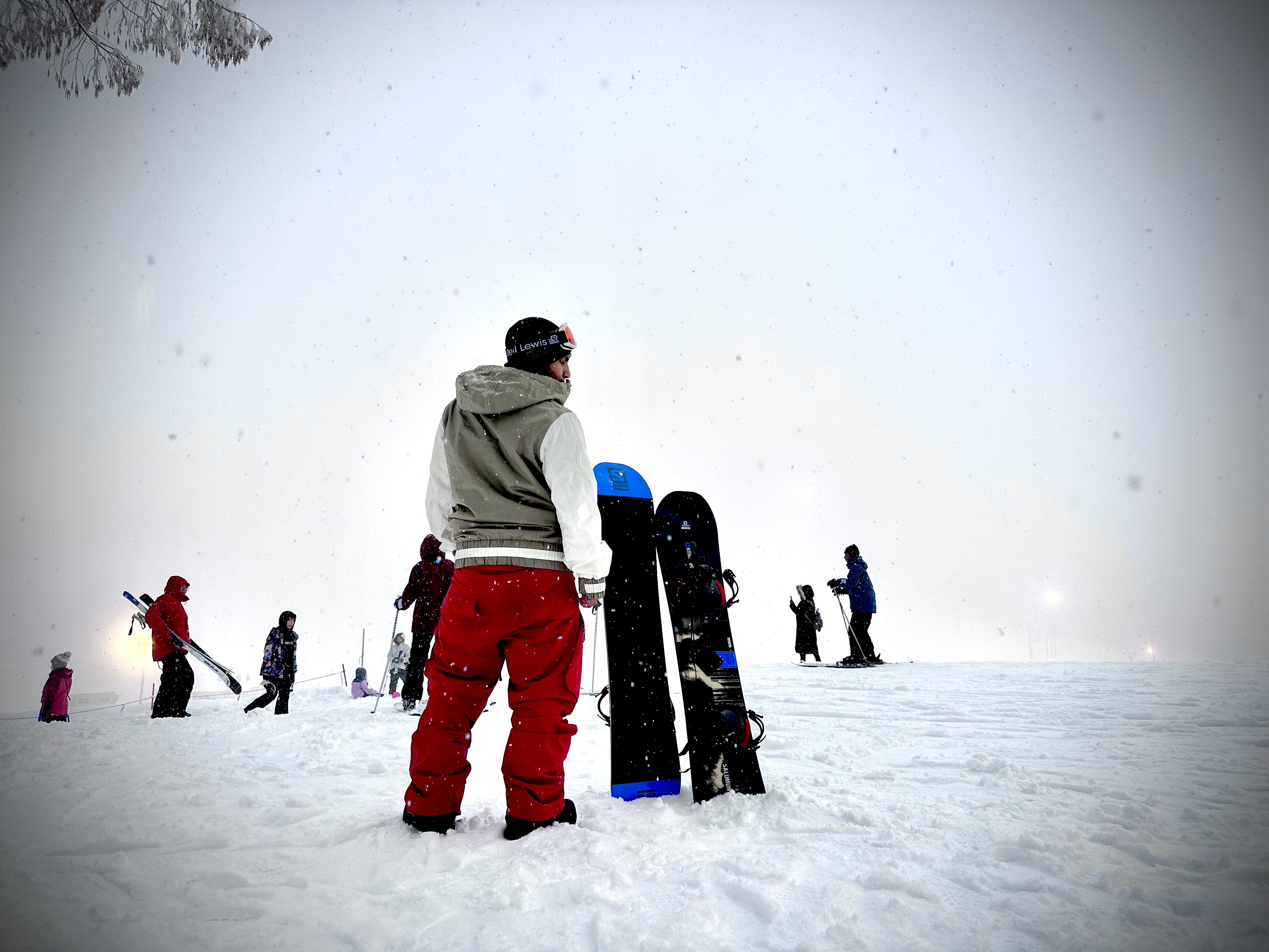 A snowboarder on a snowy slope with a board